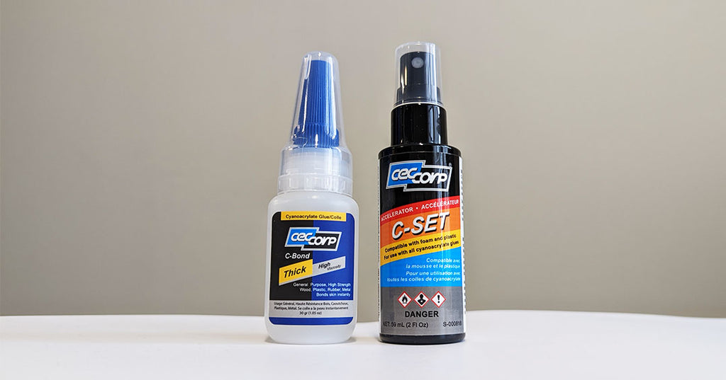 Small bottle of CA Glue beside small spray bottle of C-Set Accelerator